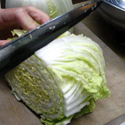 Chop The Top Part Of The Chinese Cabbage Into Two (18k)