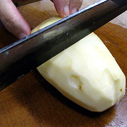 Time To Cut The Potatoes Into Pieces.  First, cut into half. (20k)