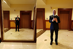 Selfie Wearing A Suit In Front Of A Big Mirror